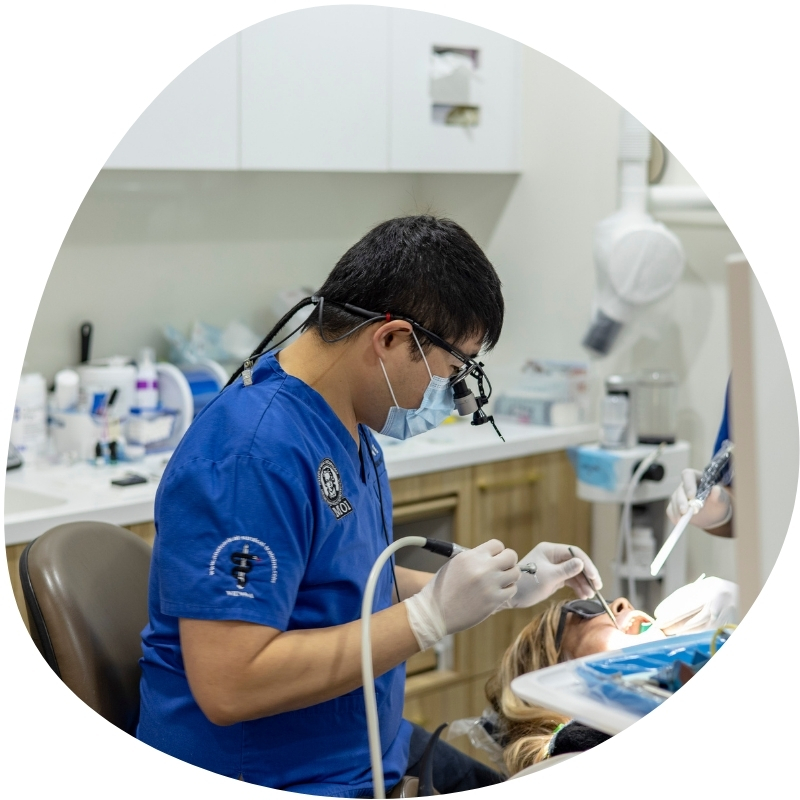 Dentist doing dental implants at the local Burwood clinic